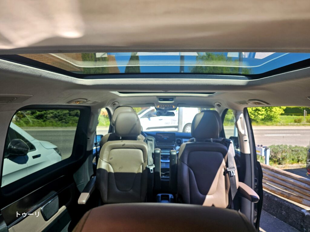 Inside the panoramic-roof vehicle — mountain views even on the road