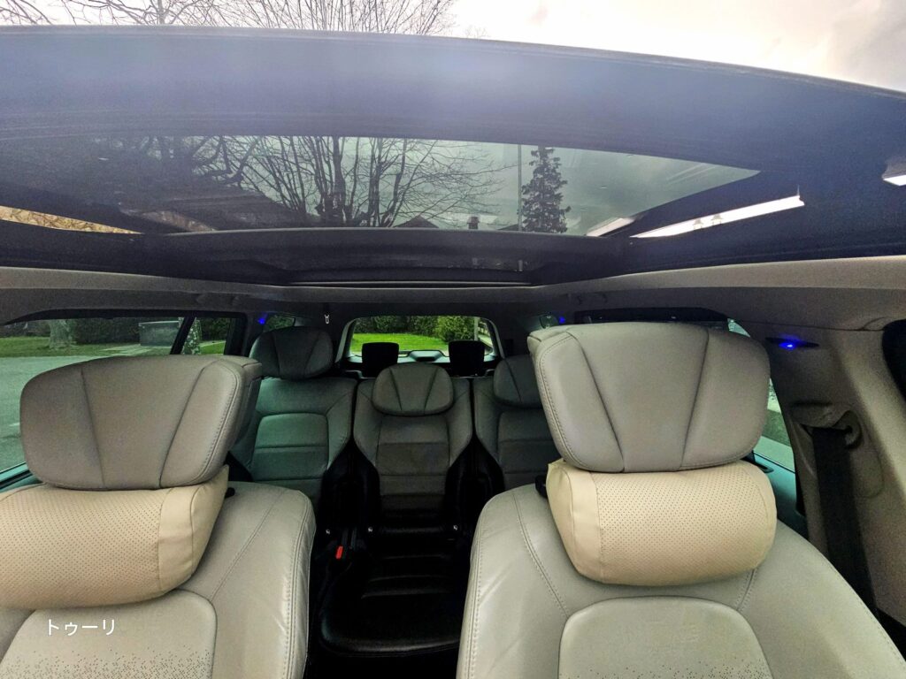 Inside the private vehicle with a glass roof, where the view continues while you travel